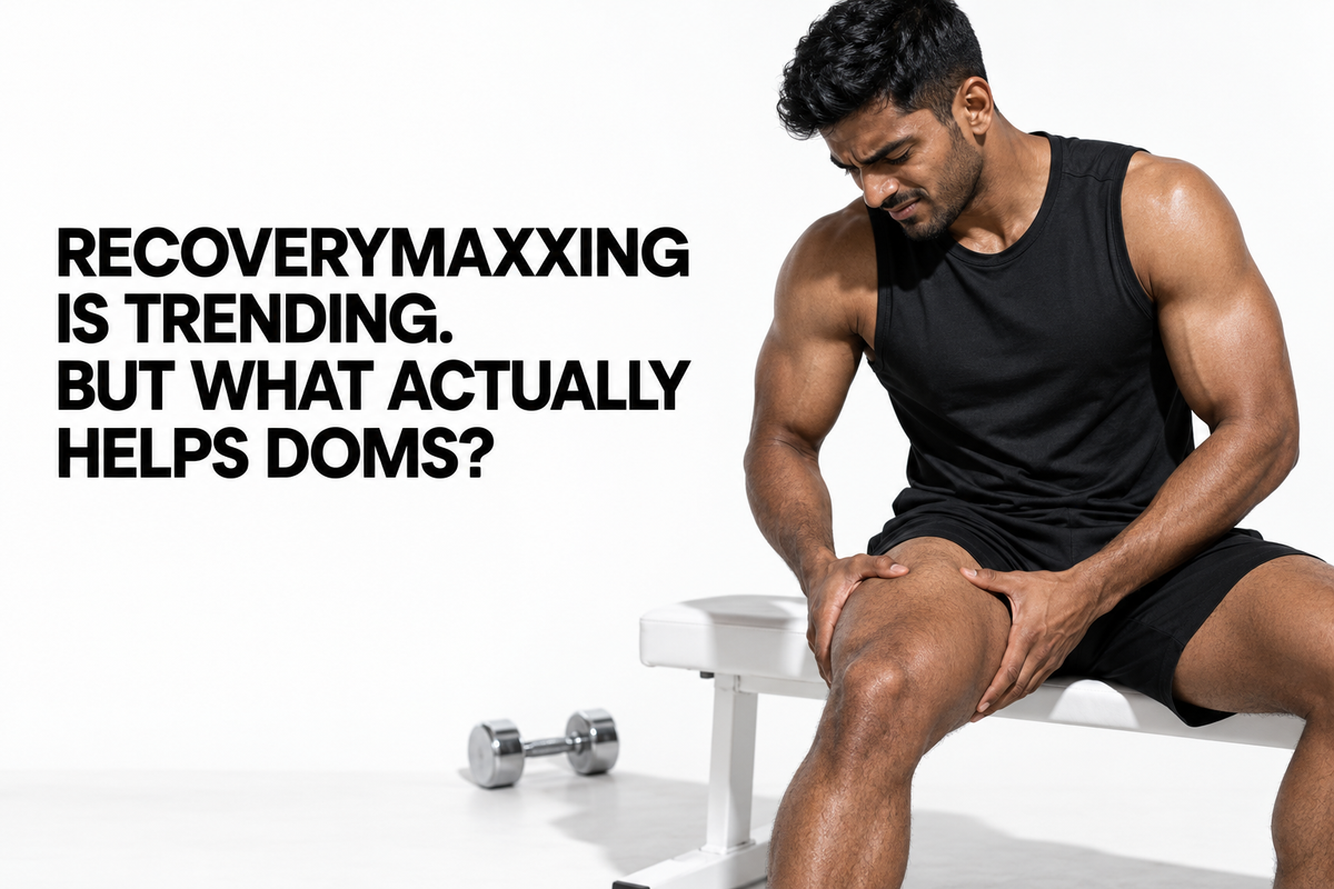 Indian athlete holding his sore thigh after leg day, illustrating recoverymaxxing and delayed onset muscle soreness.